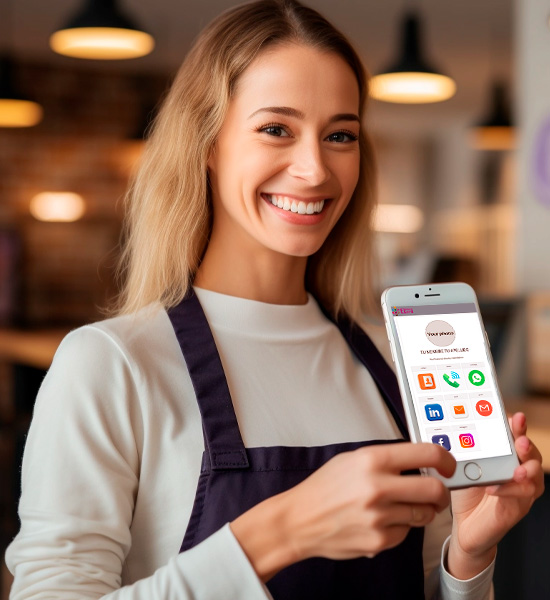 Woman at her job as a waitress, smiling and showing her cell phone with all her contact information.